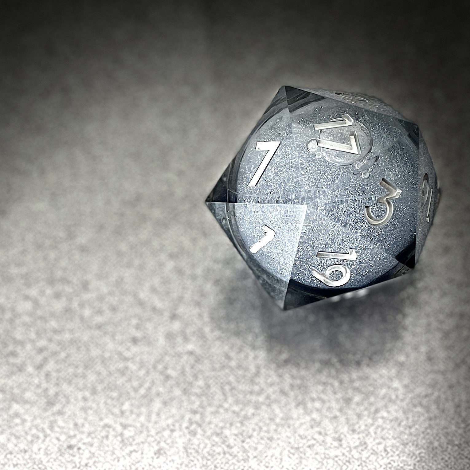 A close-up of a twenty-sided die. 
